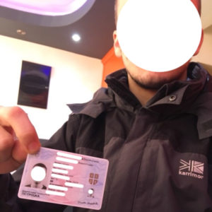 selfie holding id card